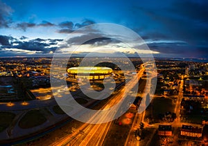 Gdansk, Poland - 19 October, 2020: Aerial landscape with amber shape Energa Stadium in Gdansk at dusk, Poland photo