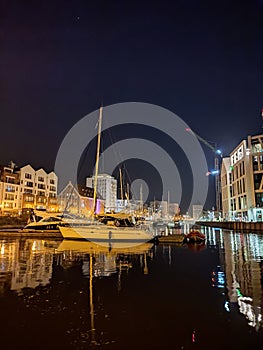 GdaÅ„sk Old Town - the Historical Port Crane Gate and Houses on the MotÅ‚awa River in the Evening Time