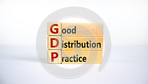 GDP, good distribution practice symbol. Concept words `GDP, good distribution practice` on blocks on a beautiful white backgroun