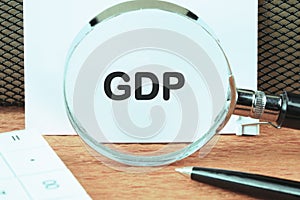 GDP, good distribution practice symbol an inscription was found using a magnifying glass on a white sheet. Concept photo