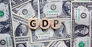 GDP, gross domestic product symbol. Concept word `GDP, gross domestic product` on circles on a beautiful background from dollar