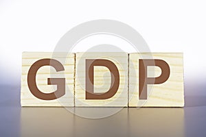 GDP letters on a wooden box,business and finance,gross domestic product