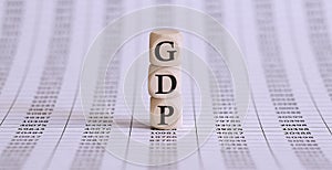 GDP word on wood blocks concept on the chart papers