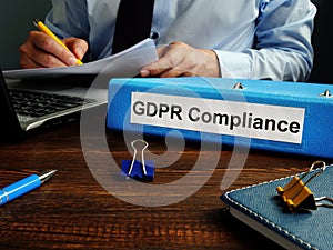 GDPR compliance and man working with papers.