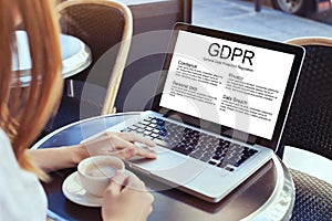 GDPR concept, woman reading about General Data Protection Regulation