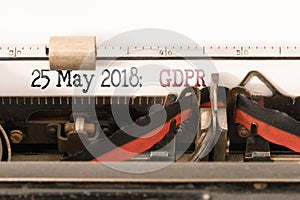 GDPR EU General Data Protection Regulation and commencement date written on manual typewriter