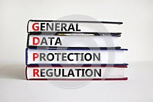 GDPR general data protection regulation symbol. Concept words `GDPR general data protection regulation` on books. Beautiful whit