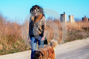 Gdpr, Girl goes for a walk with Caucasian shepherd dog in the autumn countryside