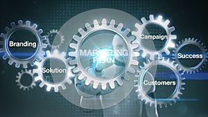 Gear with keyword, Branding, Solution, Customers, Campaign, Success, Robot cyborg touching screen `MARKETING PLAN`