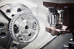 Gear milling machine work. CNC grinding machine in metalwork industry