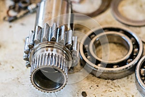 Gear shaft and ball bearing. Mechanical or car part repair concept