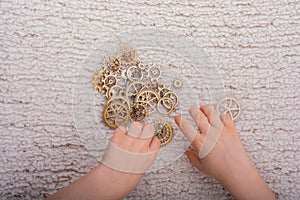 Gear wheel in hand on white background as concept of engineering