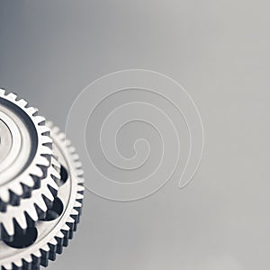 Gear wheel steel on gray background with copy-space