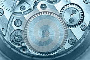 Gear wheels inside clock. Concept Teamwork. Macro