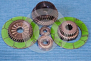Gears and bearings are laid out on clean rags.