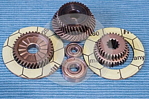 Gears and bearings are laid out on clean rags.