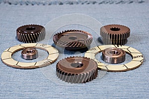 Gears and bearings are laid out on clean rags.