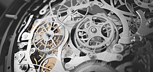 Gears and cogs in clockwork watch mechanism. Craft and precision