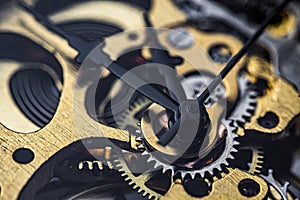 Gears and cogs inside clock. Close-up view on retro watches.