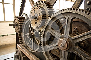 Gears and cogs of old machine close up