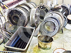Gears of disassembled engine in workshop