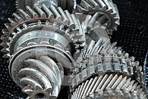 Gears from the gearbox, close-up. Repair box predach, repair of used cars. Metal background