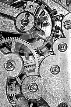 Gears and mainspring in the mechanism of a clock