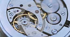 Gears And Mainspring In The Mechanism Of A Watch