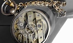 Gears in old watches. Composition of pocket watches. Closed part of mechanical watches. The movement of the hand watch.