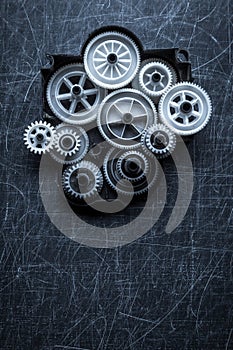 Gears on a scratched gray background