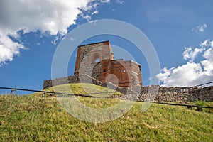 Gediminas Castle Tower on a hill covered in greenery under sunlight in Vilnius in Lithuania