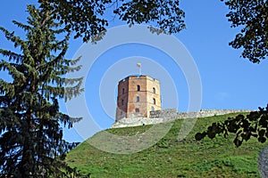 Gediminas` Tower or Castle, the remaining part of the Upper Castle in Vilnius, Lithuania with lithuanian flag