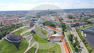 Gediminas Tower of the upper castle in Vilnius with Neris river and modern city skyline, aerial view of Lithuania