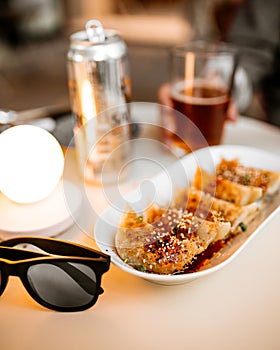 Gedza dumplings on table with glasses and beer