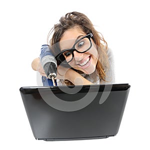 Geek woman repairing a laptop photo