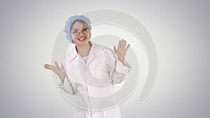 Geek young blonde doctor woman talking to camera on gradient background.