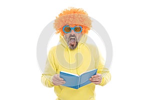 Geeky bibliophile in funky wig keep mouth open reading school book, library