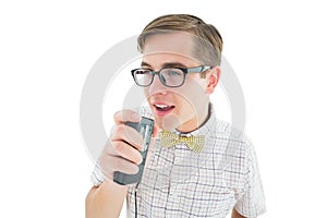 Geeky hipster speaking into dictaphone