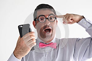 Geeky man holds a smartphone has an idea photo