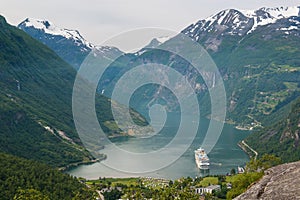 Geiranger fjord with cruise ship and waterfall, Norway