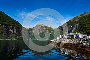 Geiranger fjord, Norway. Family vacation travel RV, holiday trip in motorhome, Caravan car Vacation