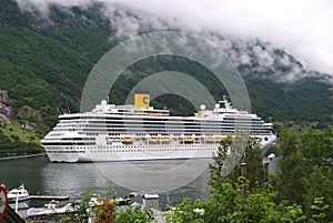 Geiranger, Norway - January 25, 2010: cruise ship in norwegian fjord. Travel destination, tourism. Adventure, discovery, journey.