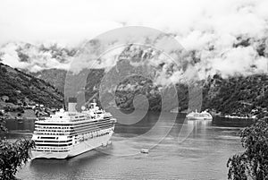 Geiranger, Norway - January 25, 2010: passenger liner docked in port. Cruise ship in norwegian fjord. Travel destination