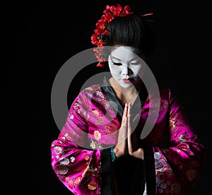 Geisha with hands together respect gesture