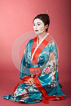 Geisha Japanese woman in kimono and facepaint