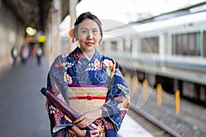 Geishas girl wearing Japanese kimono among in Kyoto, Kimono is a Japanese traditional garment. The word