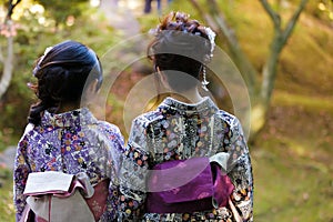 Geishas in a Japanese garden