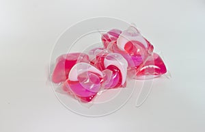 Gel ball, laundry detergent, pink and white on the washing machine