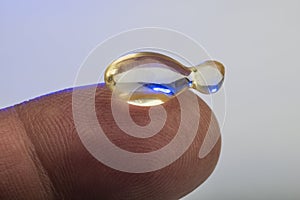 Gel capsule on finger