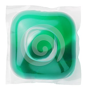Gel capsule with laundry detergent on white